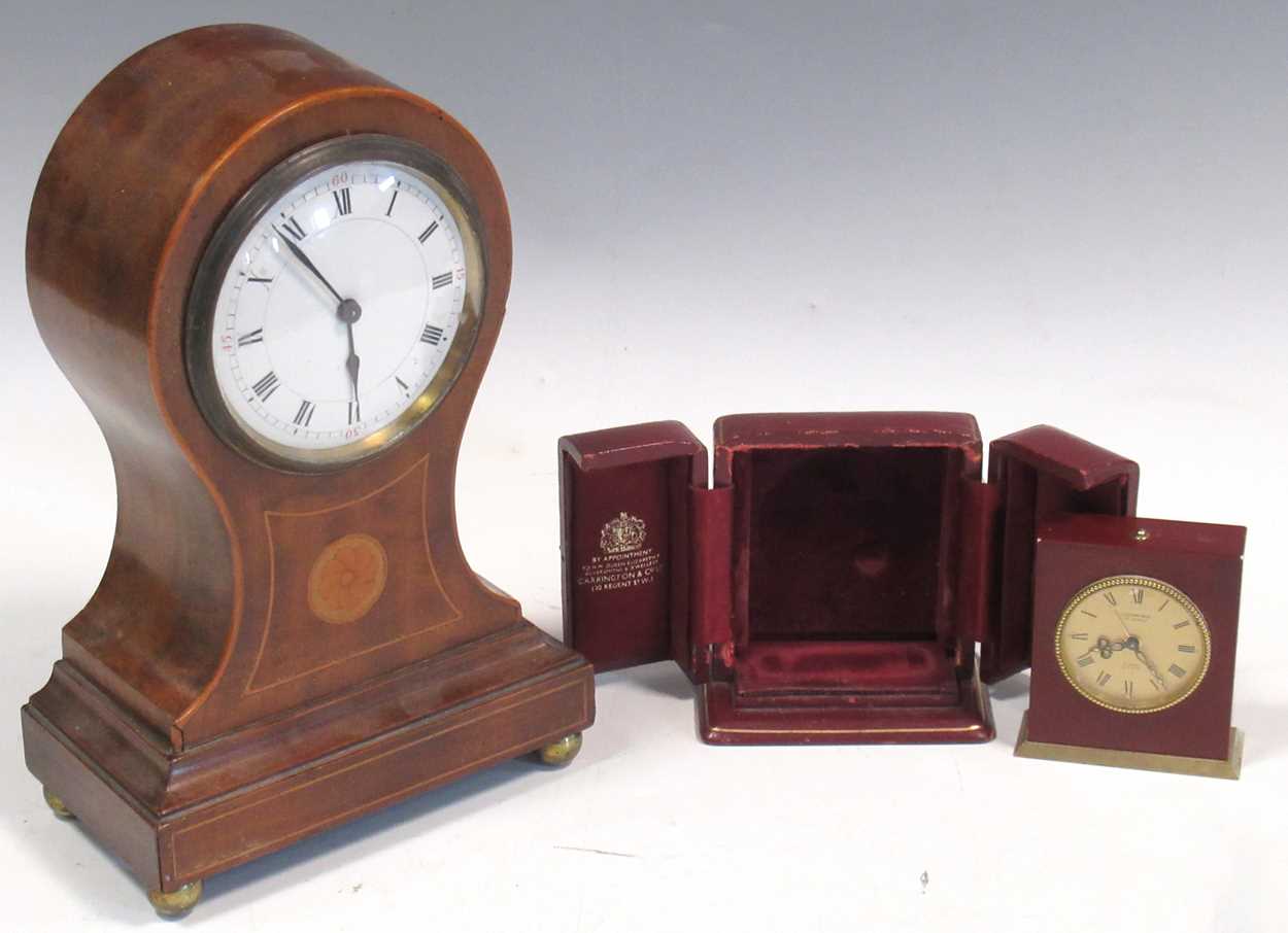 An Edwardian balloon shaped mantle clock and a Looping 15 jewel miniature travelling clock in a