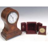 An Edwardian balloon shaped mantle clock and a Looping 15 jewel miniature travelling clock in a