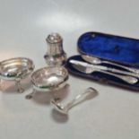 A silver caster, together with two silver salts, a cased 3-piece christening set and a silver