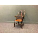 An early 19th century beech and elm Windsor wheel back armchair, 99 x 52 x 64cmStructurally good