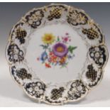 A Meissen cabinet plate, the centre painted with flowers, the shaped acanthus border moulded with