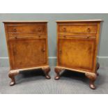 A pair of figured walnut bedside cabinets with brushing slides 67 x 44 x 36cm