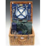 A Harrods picnic set for two within a wicker case, to include plates, knives forks, cups etc 23 x 39
