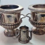 A pair of plated wine coolers with collars, engraved with armorials, one with a liner, together with