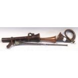 A copper and brass hunting horn in a fitted leather carrying case, a very small bugel, together with