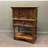 A Victorian 17th century style carved oak cabinet on fixed stand, with moulded cornice above a