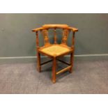 A fruitwood corner chair, 19th century,