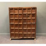 A 19th century pine panelled two door cupboard with iron strap hinges, 180 x 144 x 49cm