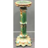 An early 20th century ceramic jardiniere 88cm high 32cm diameter