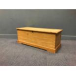 A pine blanket chest, 46 x 122 x 47cm together with a pine two-drawer unit (lacking top) 69 x 89 x