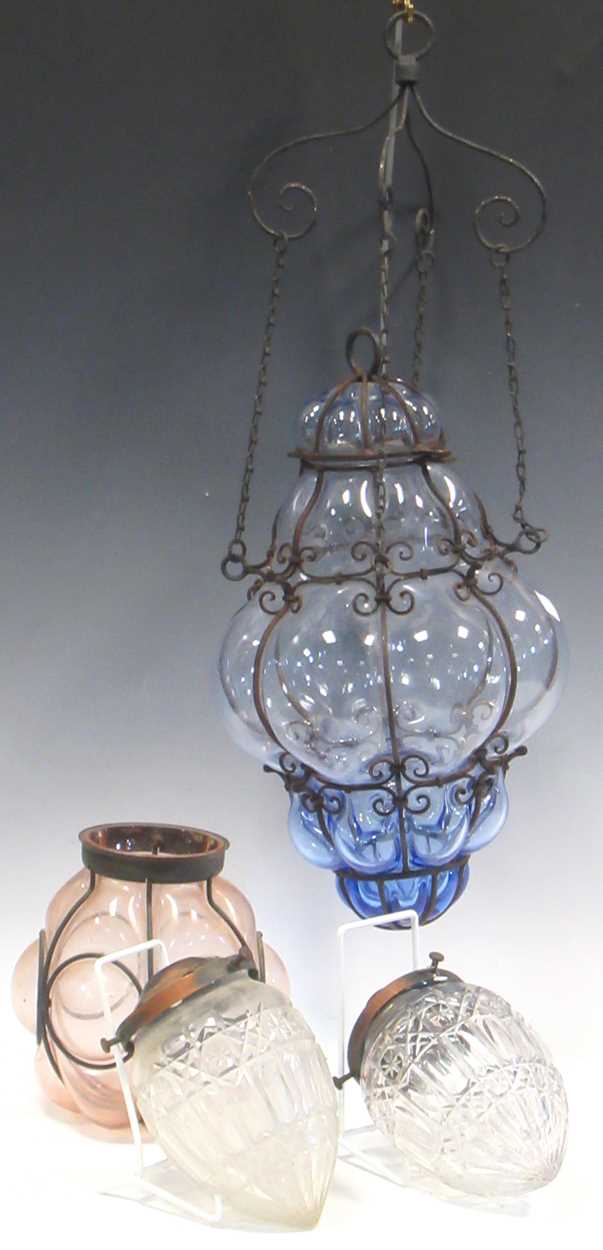 A glass lobed and blue tinted glass lantern and three other light fittings