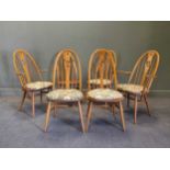 A set of six Ercol Swan chairs in elm, circa 1970s, including two carvers and four side chairs (6)