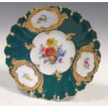 A Meissen cabinet plate, the centre painted with flowers, the broad turquoise border reserved with
