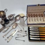 A small collection of silverware including flatware, cruets and cream jug, 12.5ozt gross weighable