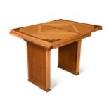 An Art Deco pale oak and walnut extending dining table,