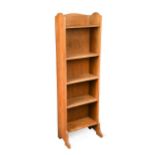 A narrow Heal's oak bookcase,