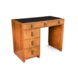 An Art Deco leather inset walnut desk,