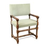 A walnut bobbin turned armchair, in the late 17th century style,