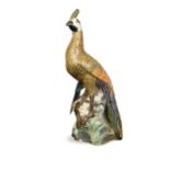 A pottery peacock, possibly French,