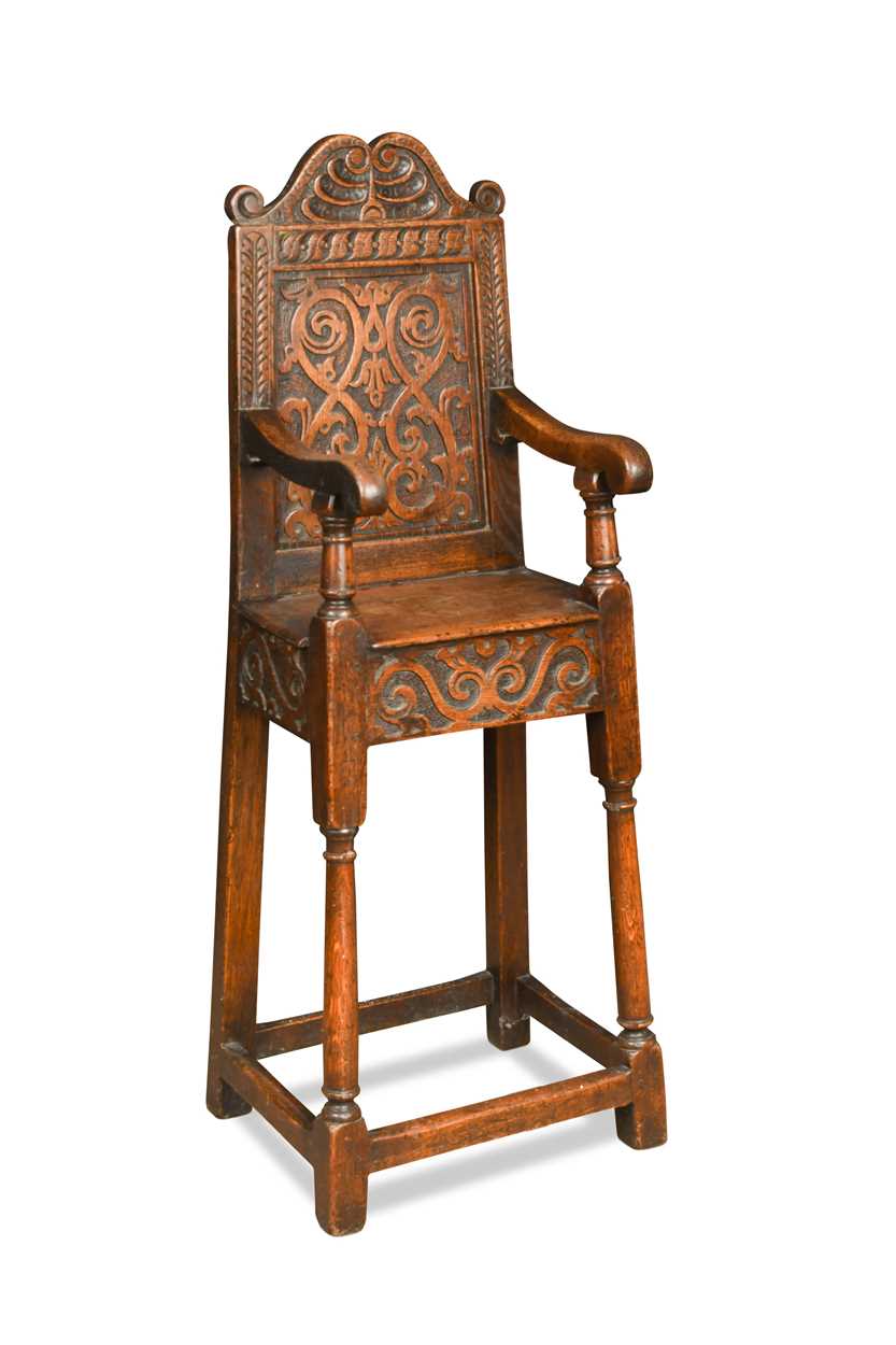 A carved oak high chair, in the 17th century style,