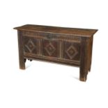 An oak coffer with three panel front, 17th century and later,