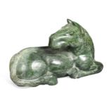 A Chinese spinach jade type recumbent horse, Ming style,