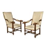 A pair of Continental walnut throne armchairs, early 19th century,