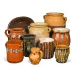 A group of slipware items and confit pots,