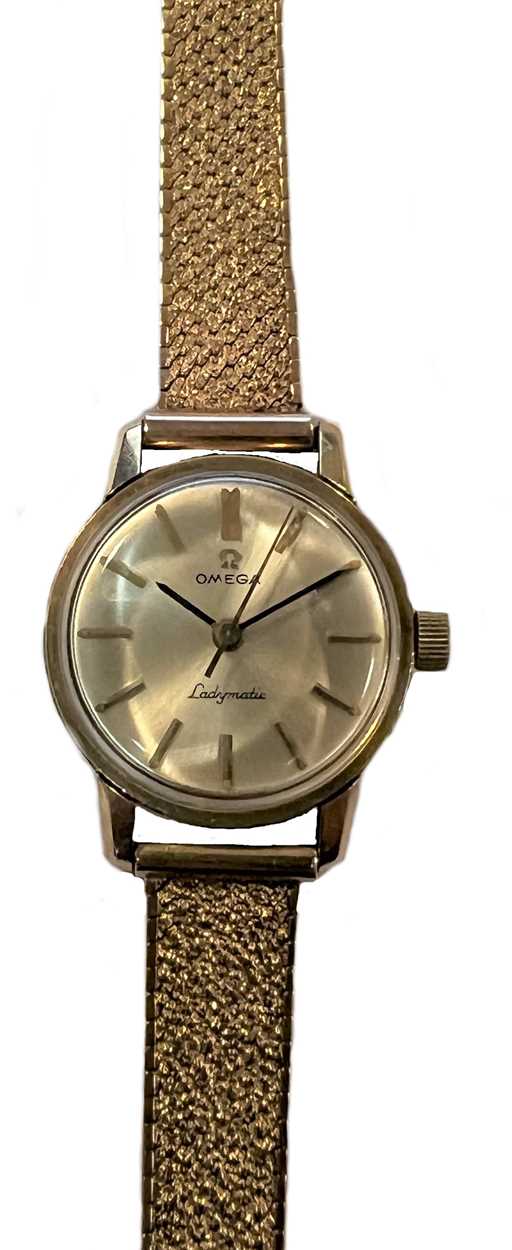 Omega - A 9ct gold 'Ladymatic' wristwatch on a later 9ct gold bracelet,