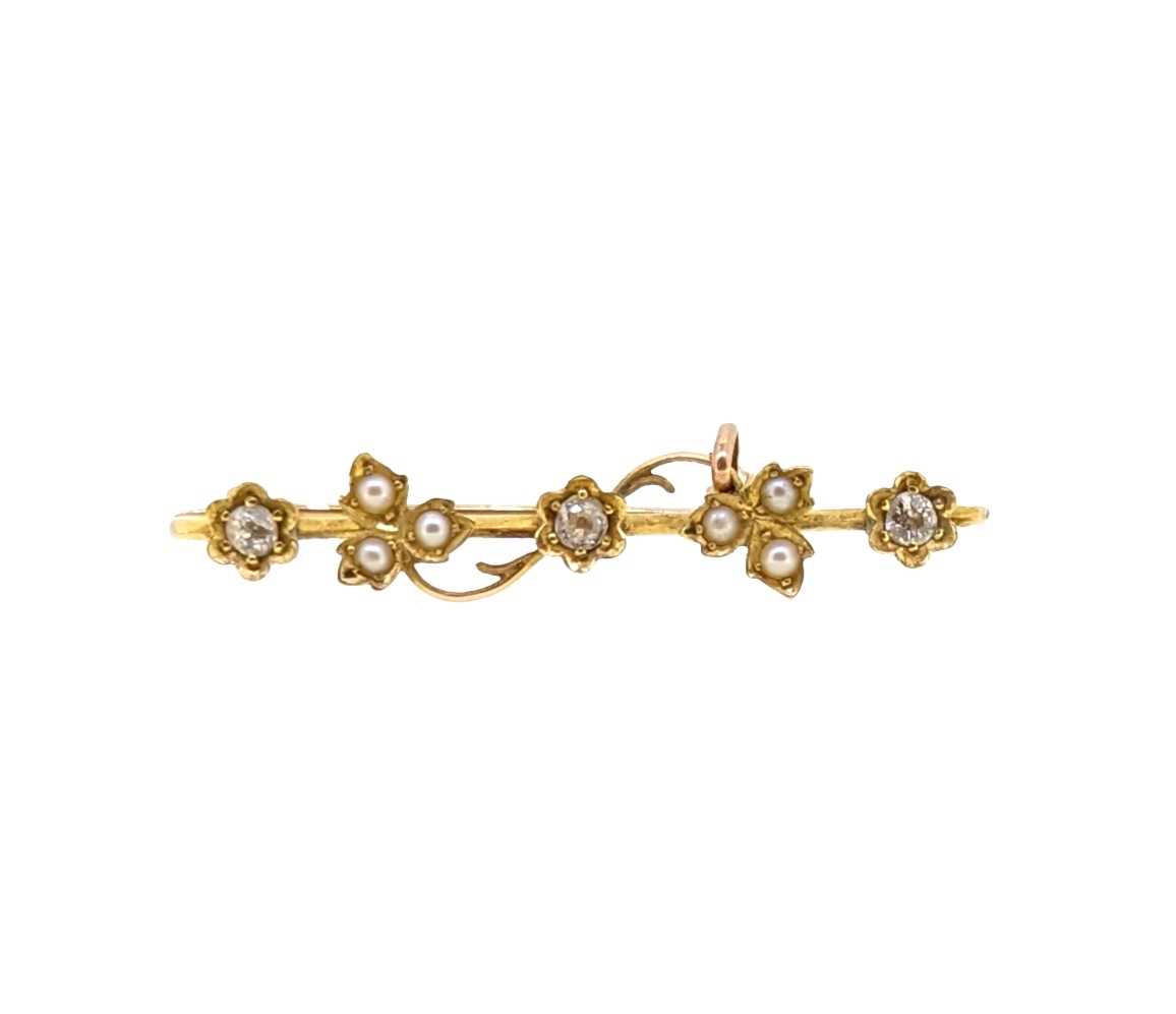 An early 20th century diamond and split pearl brooch,