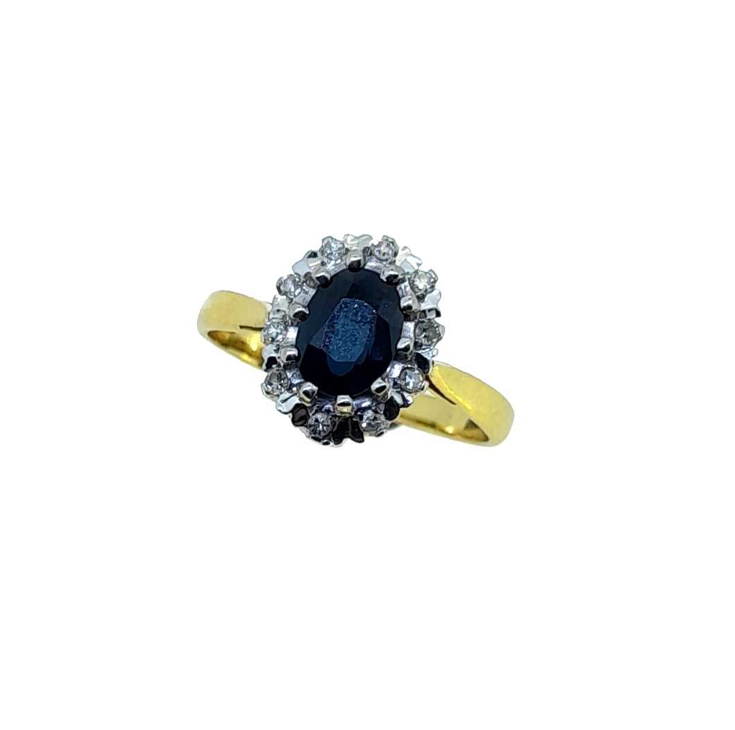 A late 20th century 18ct gold sapphire and diamond cluster ring,