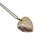 An Edwardian 9ct gold hinged heart locket and chain,