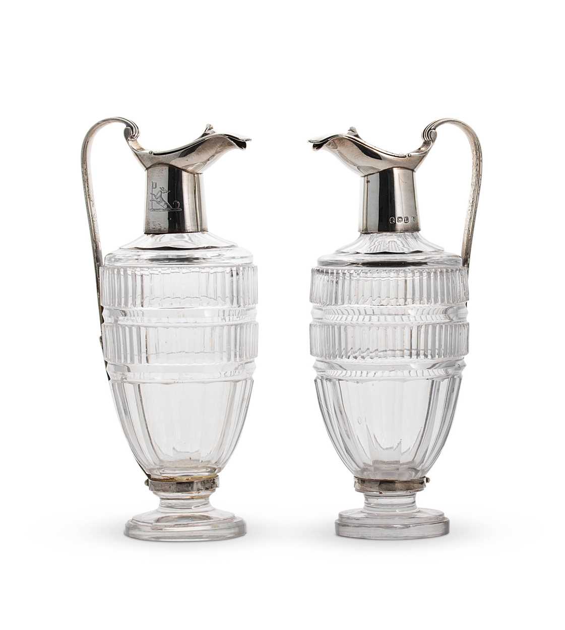 A pair of George III silver mounted cut glass cruet bottles, mark of Paul Storr,