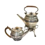 A George III silver teapot with a later spirit kettle and stand en suite,