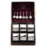 A cased set of six Victorian silver napkin rings with napkin clips en suite,