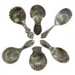 A collection of six silver caddy spoons with shell bowls, including two 18th century examples,