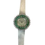 Morago - An emerald and diamond set cocktail watch,