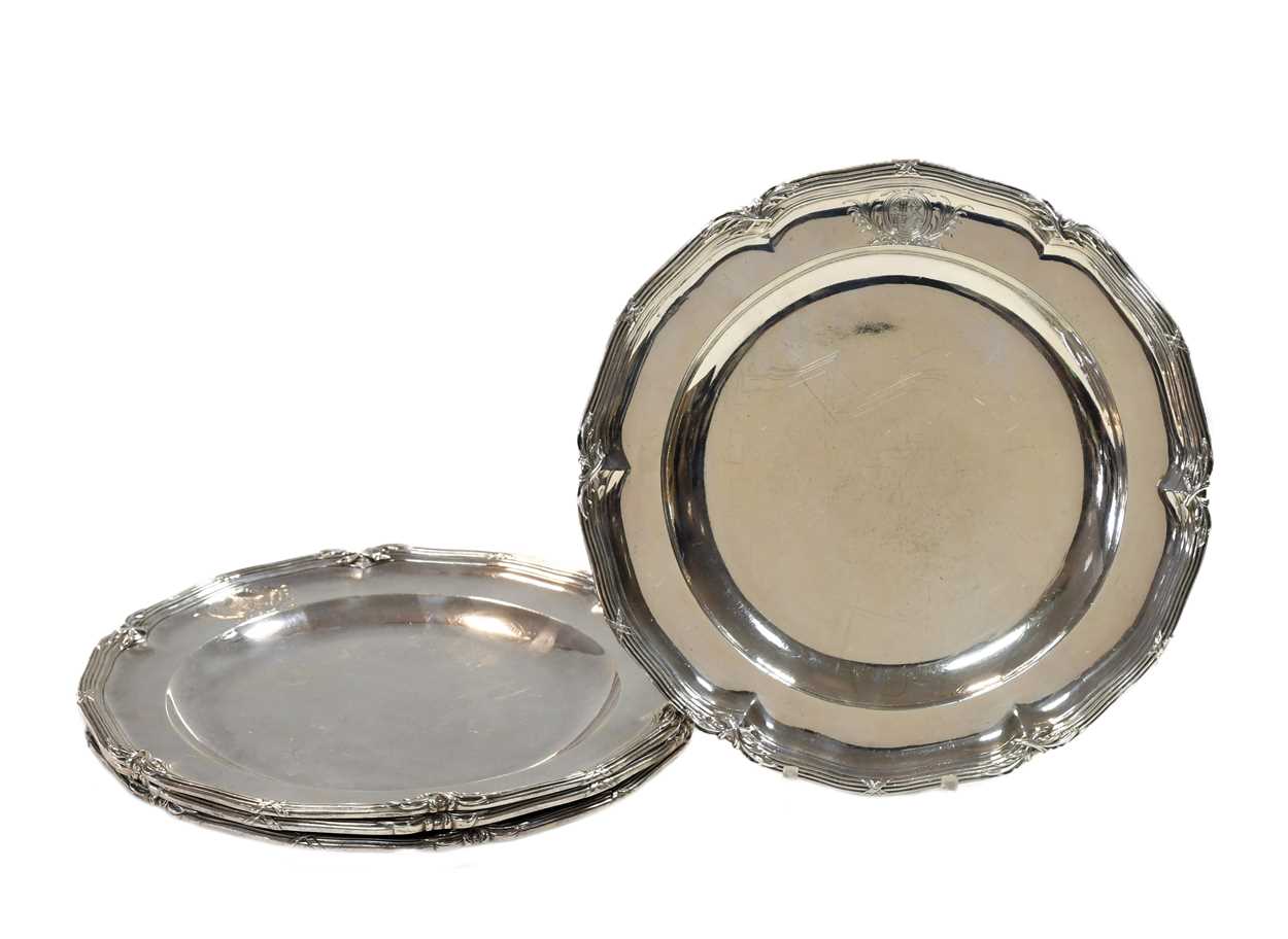 A set of four George III 18th century silver dinner plates,