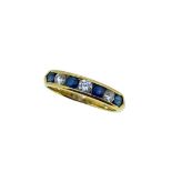 An 18ct gold sapphire and diamond half hoop ring,