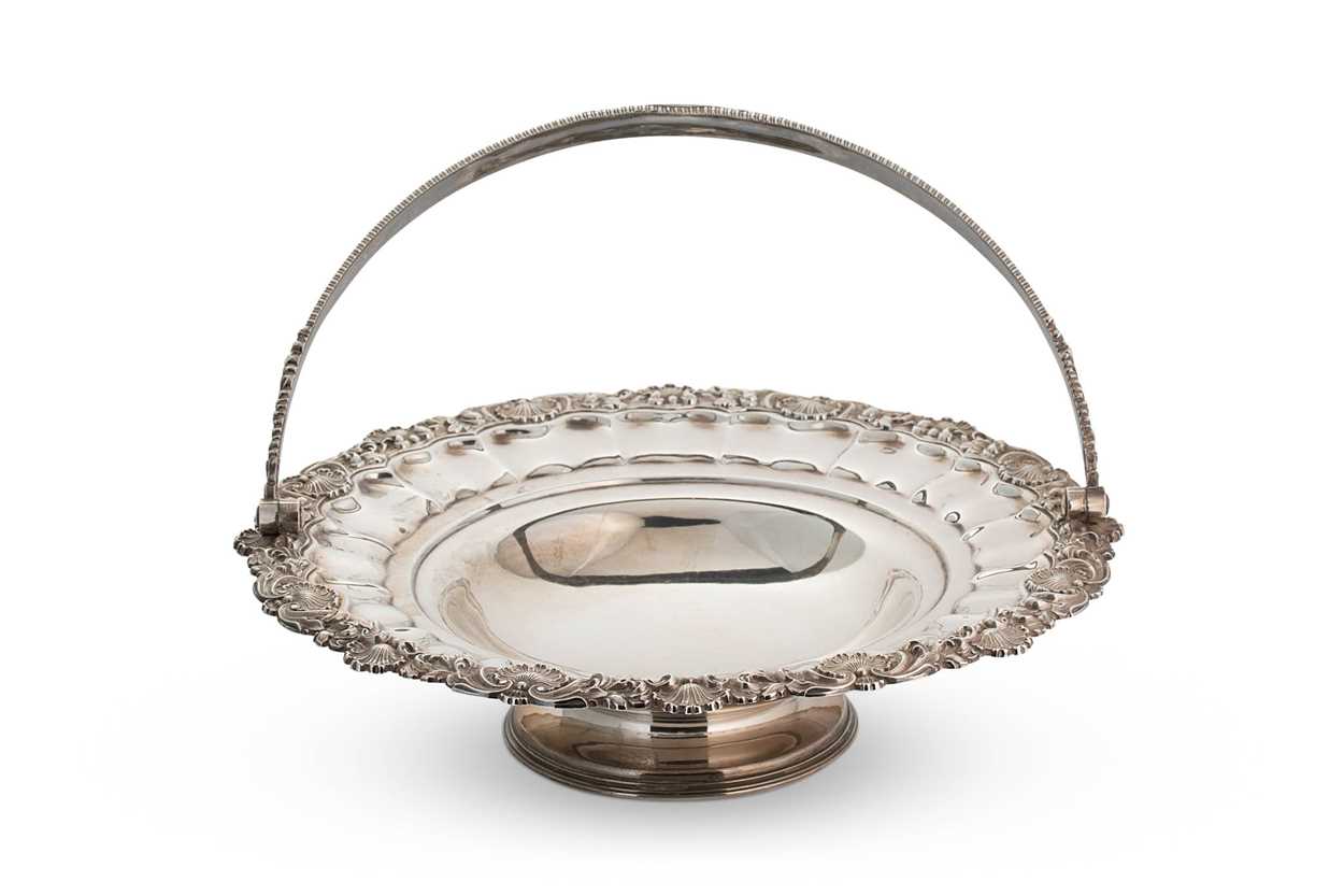 A George IV silver swing handled cake basket,