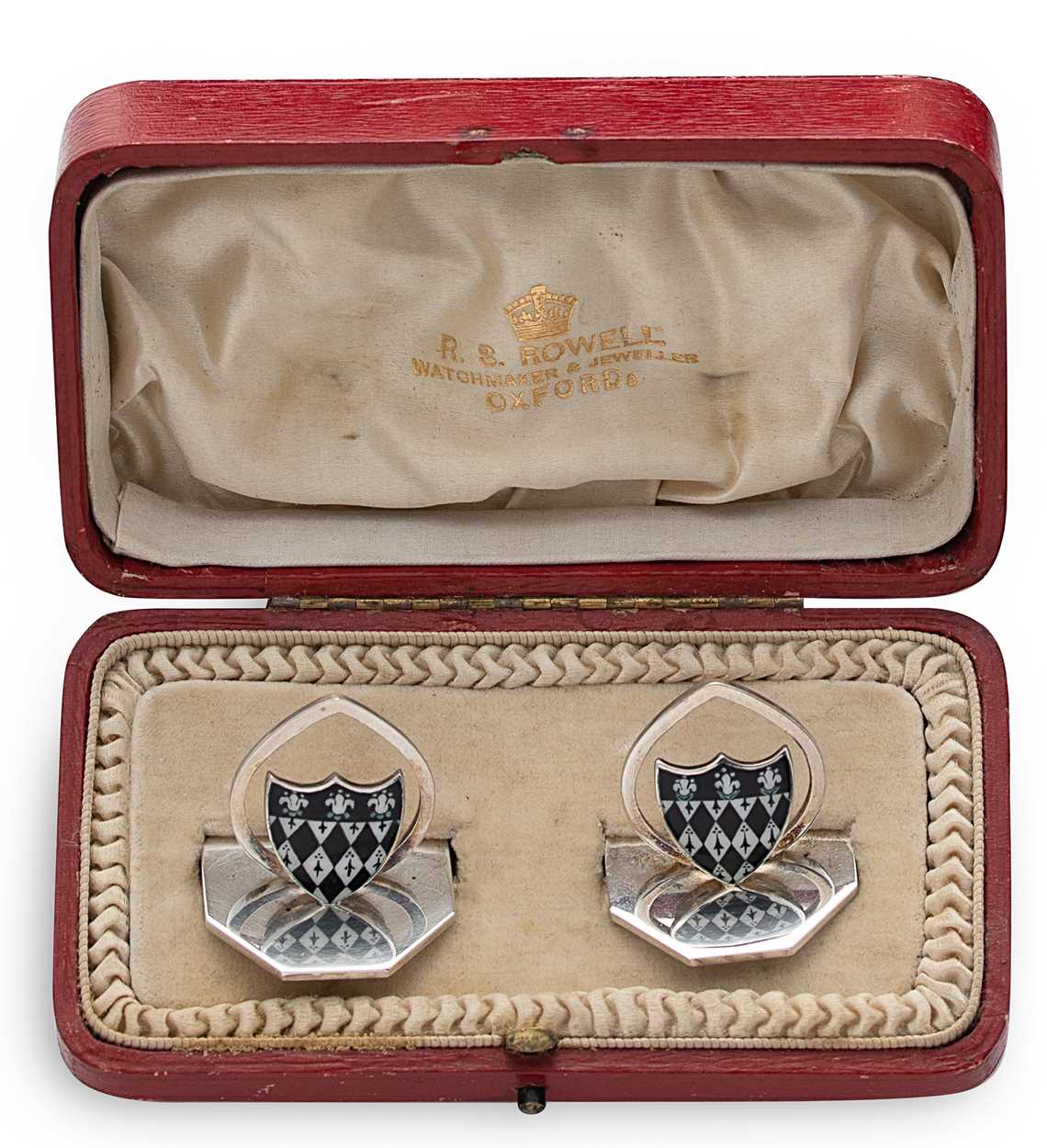 A cased pair of early 20th century silver and enamel menu/place card holders,