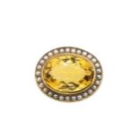 A citrine and pearl target style brooch,