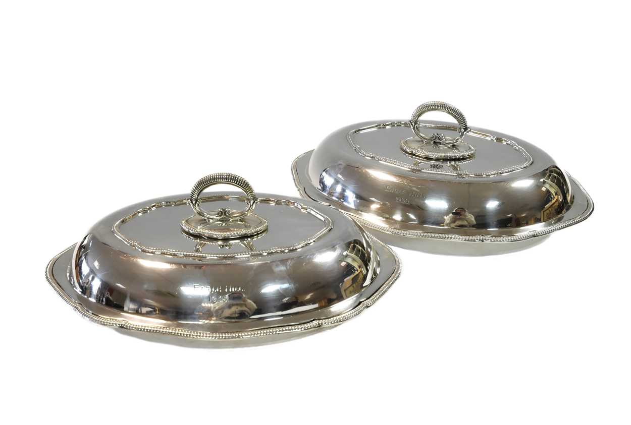 A pair of George V silver entrée dishes,