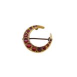 A garnet topped doublet and diamond set crescent brooch,