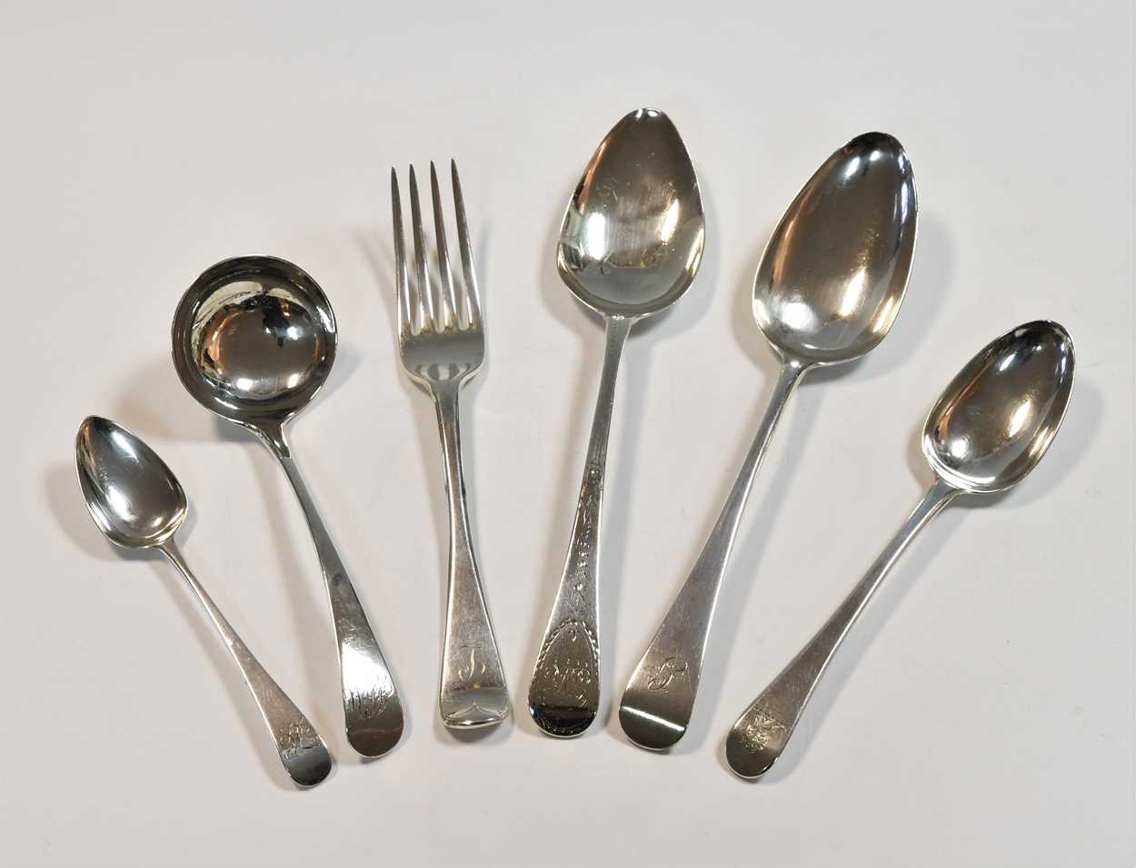 A 21-piece harlequin set of George III and later silver flatware,