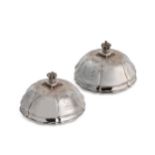 A pair of Victorian silver domed vegetable dish covers,