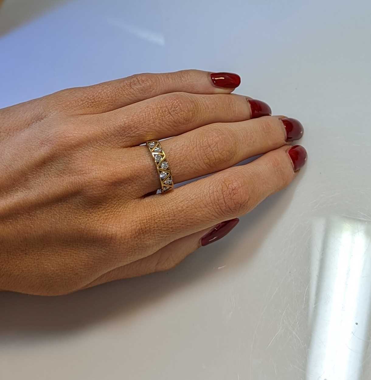 An 18ct gold seven stone diamond ring, - Image 4 of 4