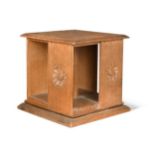 An Arts & Crafts oak table-top revolving bookcase,