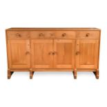A Cotswold style elm sideboard,