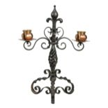 An Arts & Crafts copper and wrought iron twin-branch candelabra,
